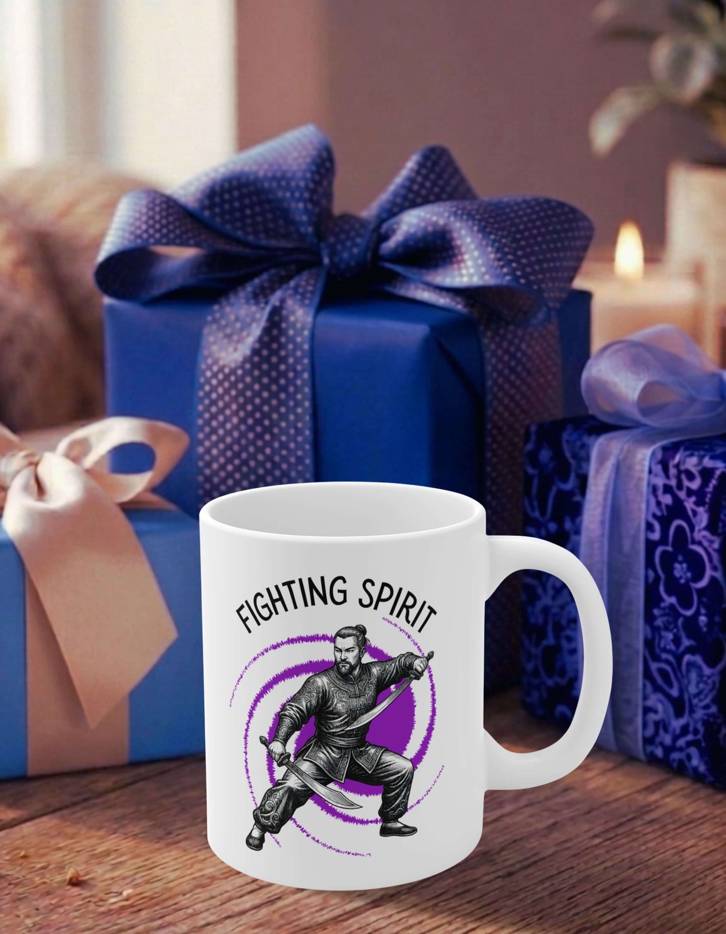 A white 11 oz ceramic mug featuring the slogan — Fighting Spirit printed in black letters, above the graphic of a fierce male warrior in fight stance wielding twin swords, surrounded by a swirling purple vortex; sits on a wooden table, in front of some thoughtfully wrapped gifts.