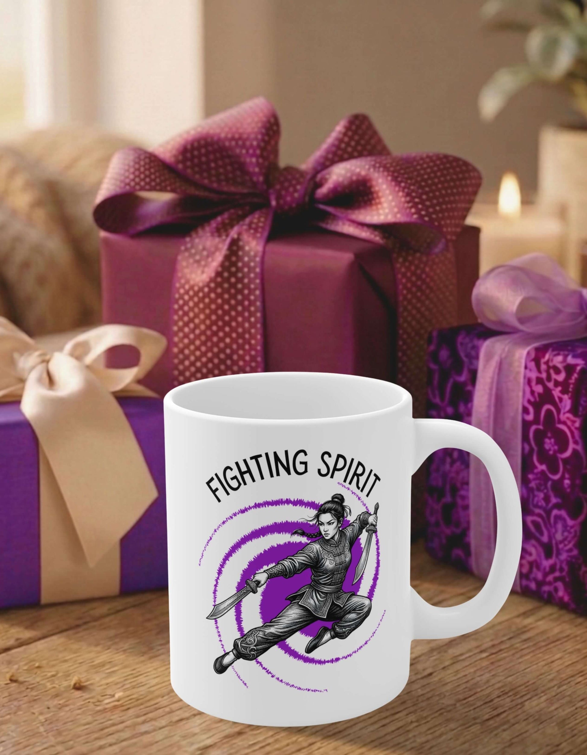 A white 11 oz ceramic mug featuring the slogan — Fighting Spirit printed in black letters, above the graphic of a female warrior mid-air wielding twin swords, surrounded by a swirling purple vortex; sits on a wooden table, in front of some thoughtfully wrapped gifts.