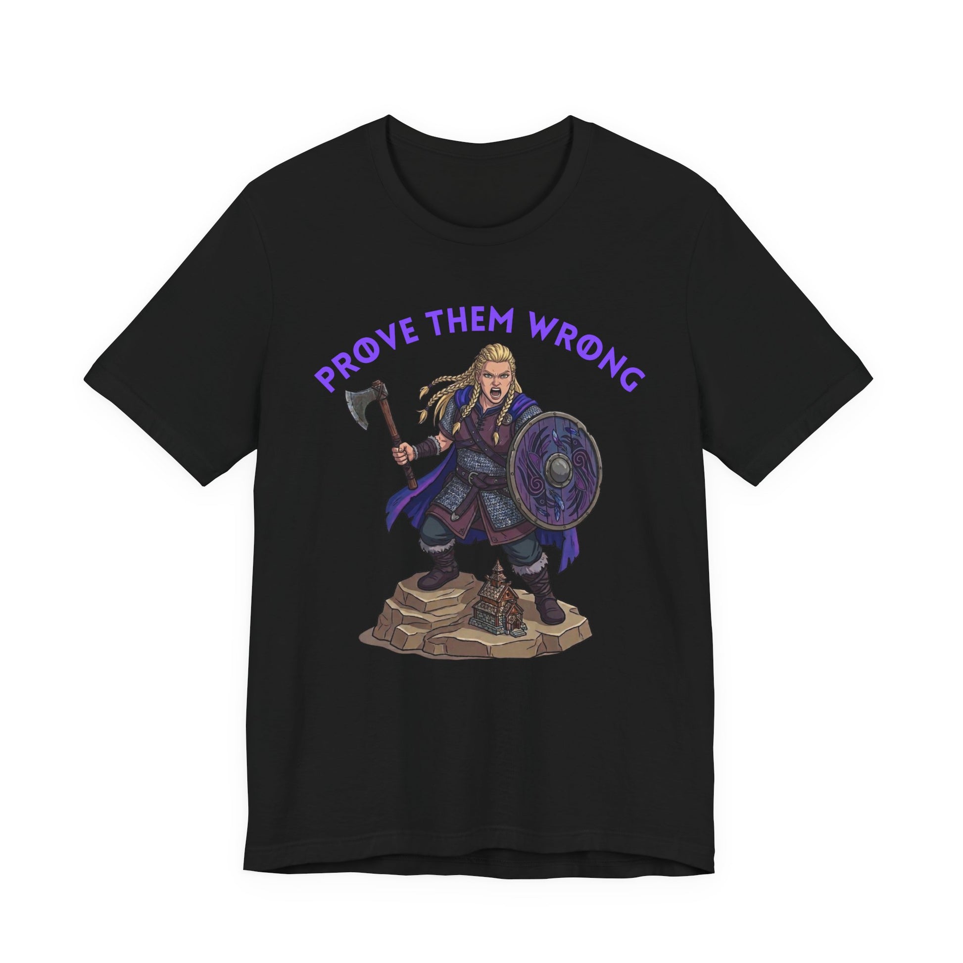 A black short-sleeve crewneck t-shirt featuring a graphic of a female Viking warrior holding an axe and shield, with the purple text 'PROVE THEM WRONG' arched above her, displayed on a solid white background.