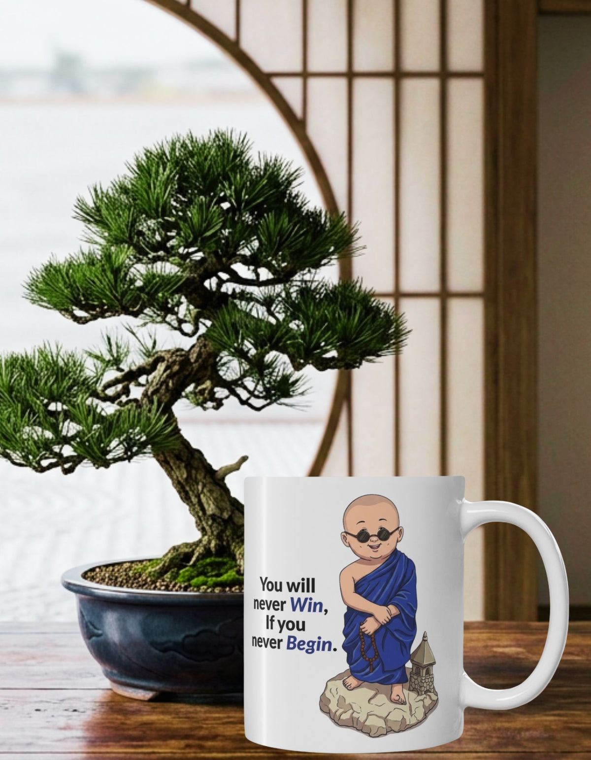 A white ceramic mug with an illustration of a monk in blue robes and the text 'You will never Win, if you never Begin.' placed on a wooden table next to a potted bonsai tree in a Japanese-style room.